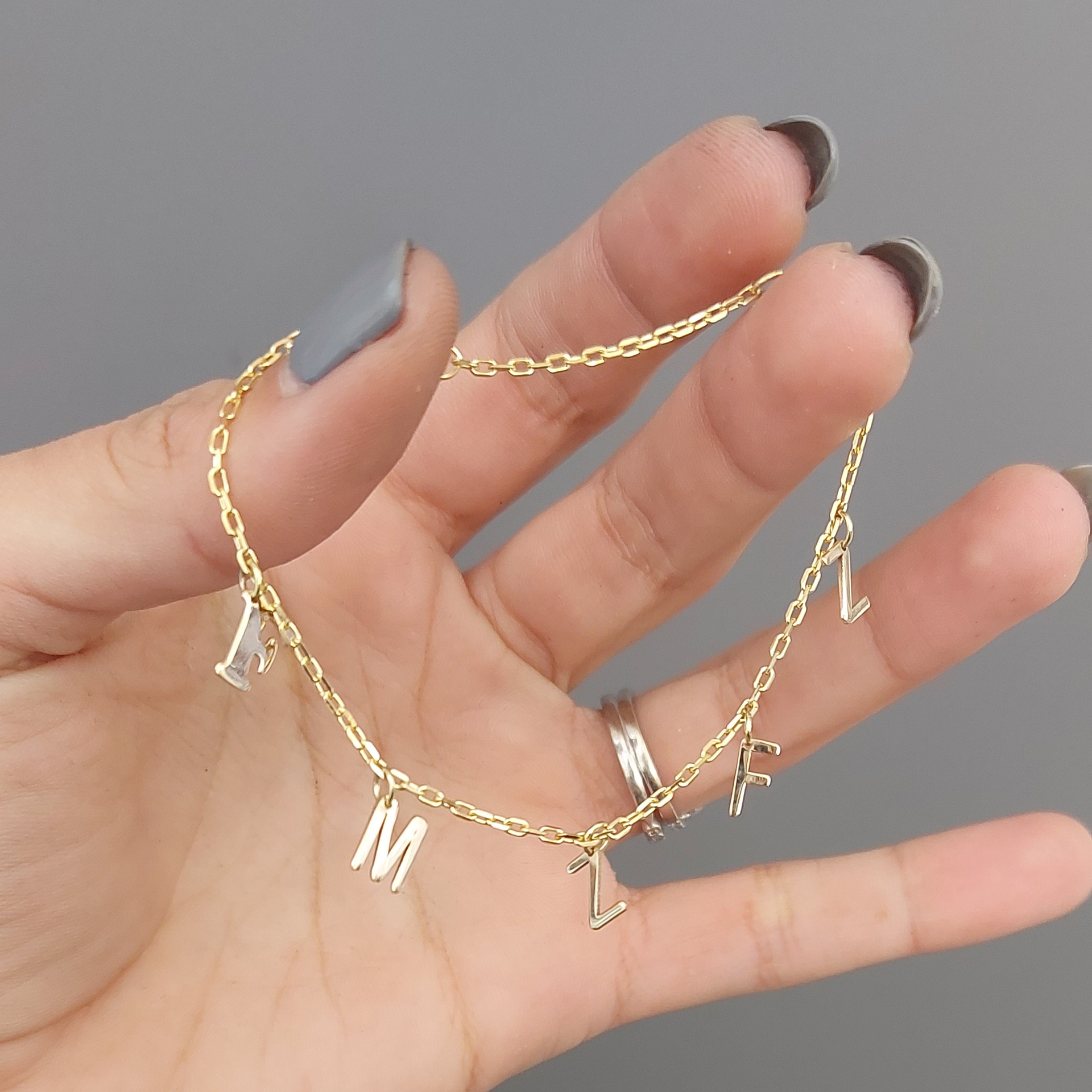 Cut-out letter Bracelet